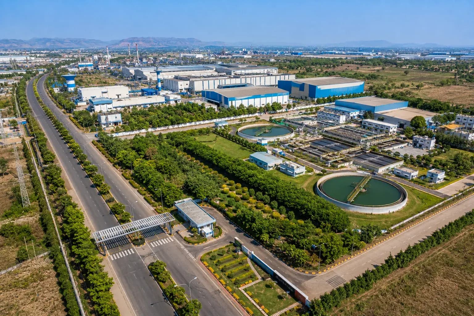 Aerial view of an industrial estate with a wastewater treatment plant in its grounds