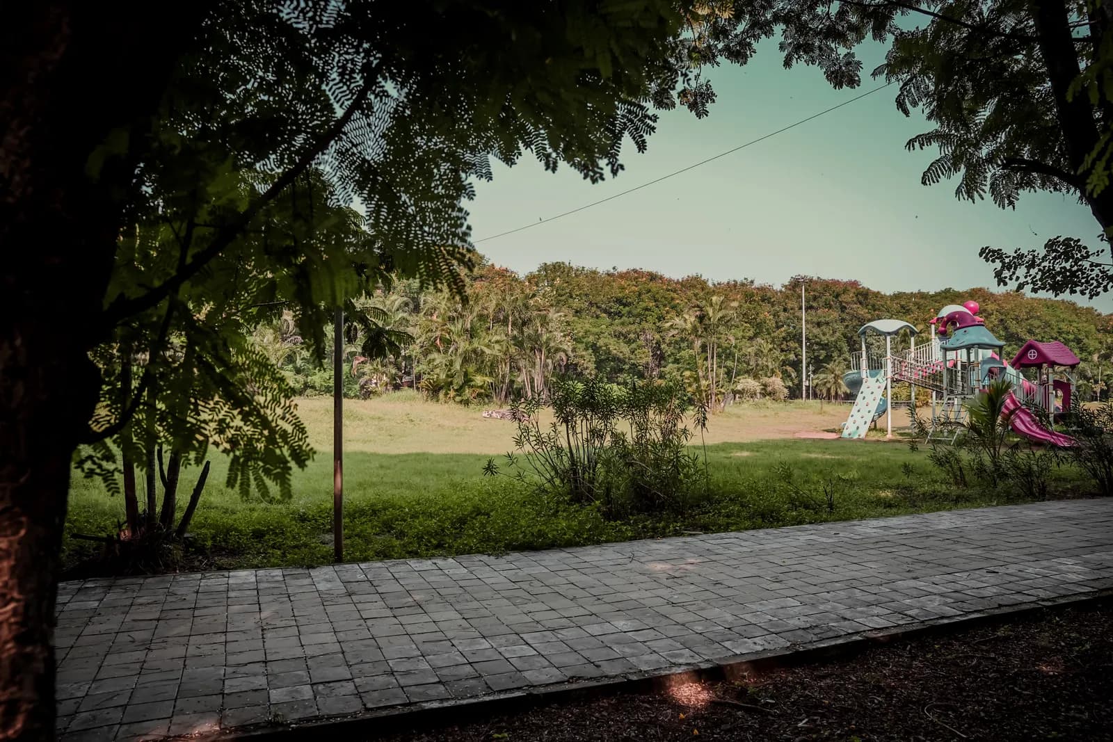 The finished landscaped recreational space at Kalamboli Sector 2: play equipment, walkways and planting