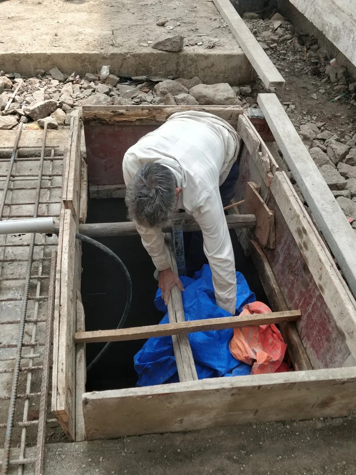 Reinforced concrete tank structures and pipework under construction at a sewage treatment plant
