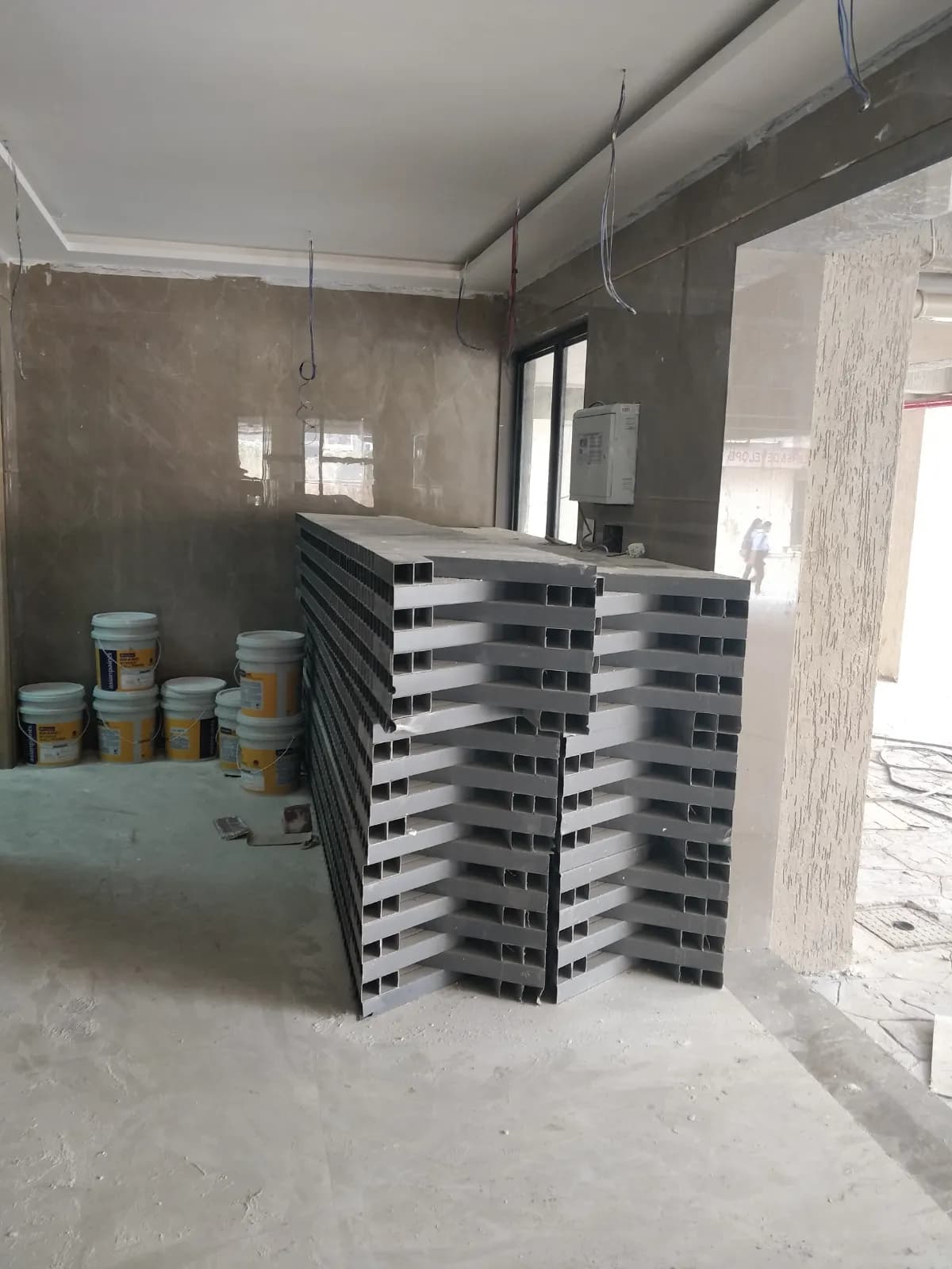 Reinforced concrete tank structures and pipework under construction at a sewage treatment plant