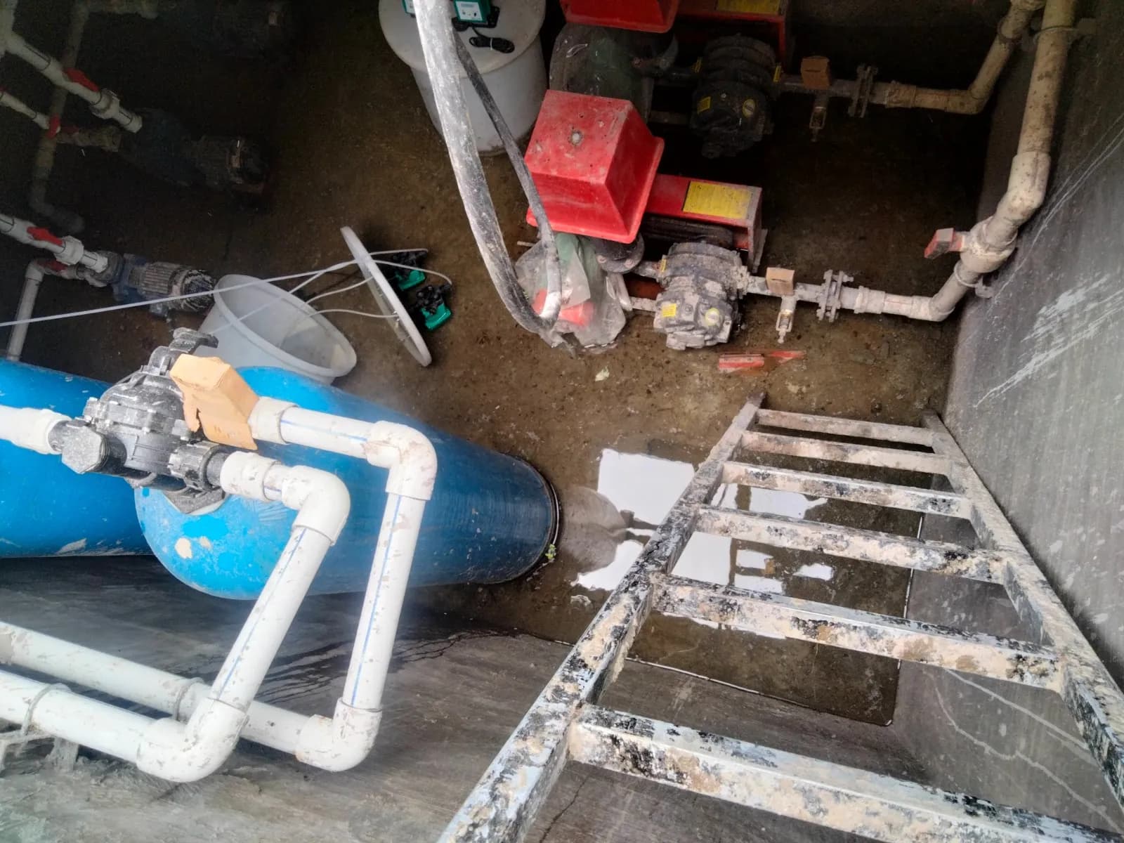 Reinforced concrete tank structures and pipework under construction at a sewage treatment plant