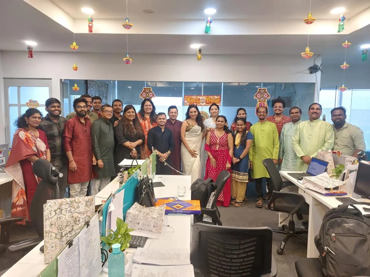 KIPL colleagues in festive dress around a long table at the office Diwali lunch