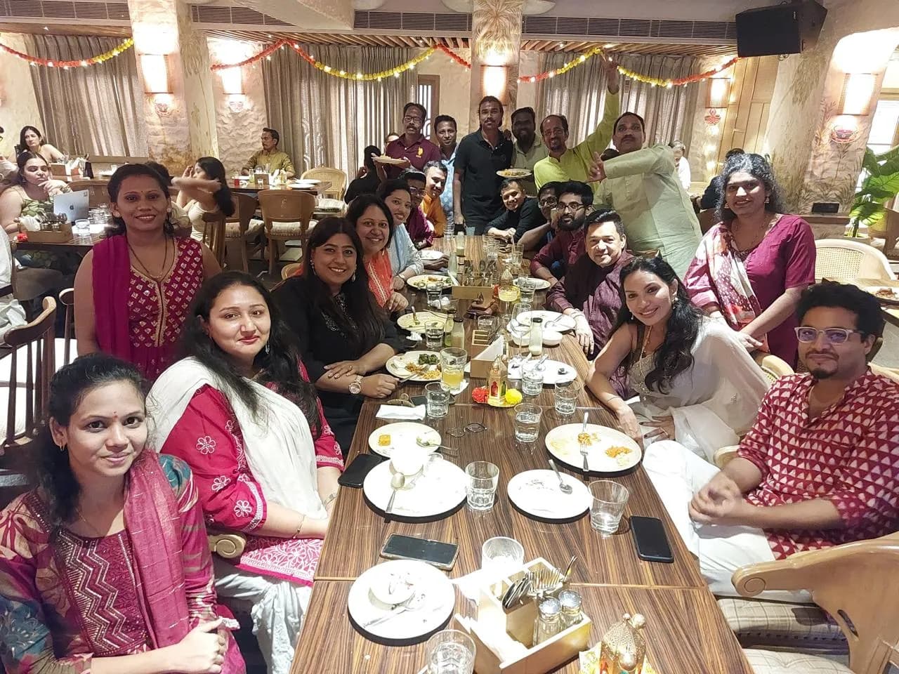 KIPL colleagues in festive dress around a long table at the office Diwali lunch