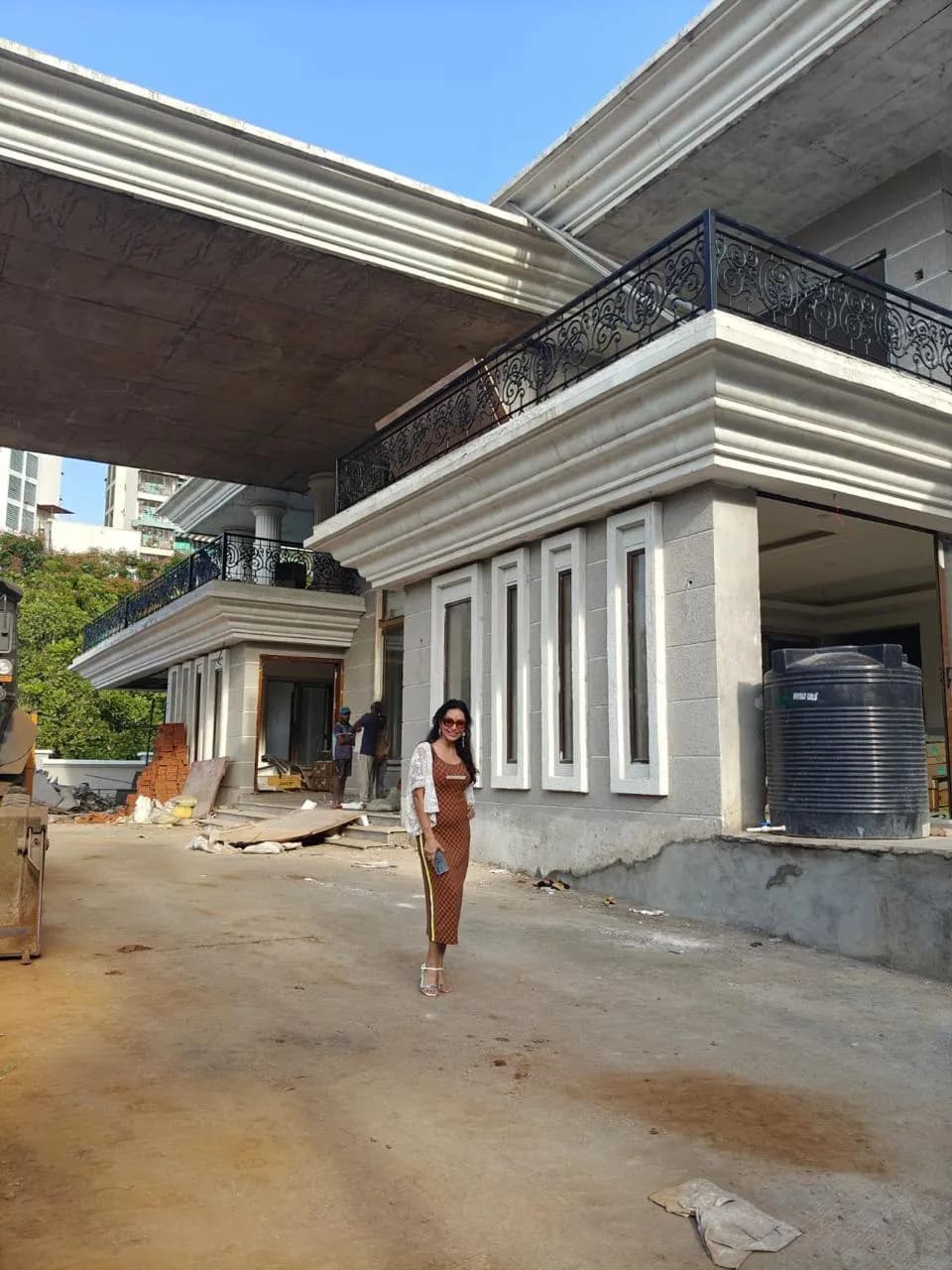 KIPL colleagues outside a completed building at Kharghar